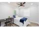 Cozy bedroom with natural light, ceiling fan, and desk area, ideal for relaxation and work at 2300 23Rd S St, St Petersburg, FL 33712