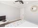 Bedroom with ceiling fan, side table, and a wall-mounted TV at 2300 23Rd S St, St Petersburg, FL 33712
