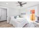 Bedroom with natural light, a ceiling fan, light walls, and light wood floors at 2300 23Rd S St, St Petersburg, FL 33712