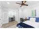 Bedroom features ceiling fan, desk and additional built-in desk with extra cabinet and storage space at 2300 23Rd S St, St Petersburg, FL 33712