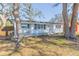 Charming single-story home with a white picket fence and mature trees shading the front yard at 2300 23Rd S St, St Petersburg, FL 33712