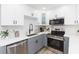 Bright kitchen with white cabinets, stainless steel appliances, and a spacious island at 2300 23Rd S St, St Petersburg, FL 33712