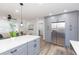 Bright kitchen with stainless steel refrigerator, shaker cabinets, and a spacious island at 2300 23Rd S St, St Petersburg, FL 33712