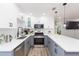 Modern kitchen featuring stainless steel appliances, white cabinets, and quartz countertops at 2300 23Rd S St, St Petersburg, FL 33712