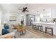 Bright, open-concept living space with a modern kitchen, stylish furnishings, and wood flooring at 2300 23Rd S St, St Petersburg, FL 33712
