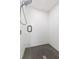 Elegant shower featuring black hardware, white tiled walls, and hexagon tile floor at 2300 23Rd S St, St Petersburg, FL 33712