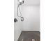 Modern walk-in shower featuring subway tile walls and a dark honeycomb tile floor at 2300 23Rd S St, St Petersburg, FL 33712