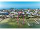 Beautiful waterfront home surrounded by lush landscaping with a private pier at 2306 Canasta Dr, Bradenton Beach, FL 34217