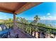 Beautiful wrought iron balcony overlooking the water and lush landscaping at 2306 Canasta Dr, Bradenton Beach, FL 34217
