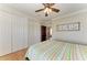 Comfortable bedroom with ceiling fan and closet storage at 2306 Canasta Dr, Bradenton Beach, FL 34217