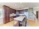 Well-appointed kitchen featuring granite countertops, stainless steel appliances, and convenient seating at the center island at 2306 Canasta Dr, Bradenton Beach, FL 34217