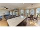 Spacious kitchen with a large island and breakfast bar that is centrally located to the living and dining areas at 2306 Canasta Dr, Bradenton Beach, FL 34217