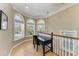 Cozy landing area with natural light from surrounding windows, perfect for a home office at 2306 Canasta Dr, Bradenton Beach, FL 34217