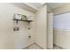 Functional laundry room with natural light and storage shelf at 2306 Canasta Dr, Bradenton Beach, FL 34217