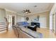 Comfortable living room featuring hardwood floors, neutral decor, and natural light at 2306 Canasta Dr, Bradenton Beach, FL 34217