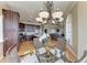 Open-concept kitchen, dining, and living areas create a unified and welcoming space with hardwood floors and water views at 2306 Canasta Dr, Bradenton Beach, FL 34217