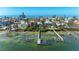 Aerial view of waterfront homes with docks and clear turquoise waters at 2308 Canasta Dr, Bradenton Beach, FL 34217