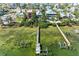 Aerial shot of waterfront homes with private docks surrounded by clear waters at 2308 Canasta Dr, Bradenton Beach, FL 34217