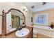 Well-appointed bathroom featuring a large vanity, soaking tub, and separate shower with decorative tile at 2308 Canasta Dr, Bradenton Beach, FL 34217