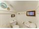 Quaint bathroom with unique mirror, complemented by bright white fixtures and natural light at 2308 Canasta Dr, Bradenton Beach, FL 34217