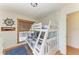 ' bedroom with a white bunk bed and wooden accents, offering a fun and functional space at 2308 Canasta Dr, Bradenton Beach, FL 34217