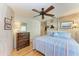 Tranquil bedroom with wood accents, a comfortable bed, and ample closet space for storage at 2308 Canasta Dr, Bradenton Beach, FL 34217
