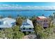 Charming coastal home with a metal roof, waterfront views, and inviting balcony at 2308 Canasta Dr, Bradenton Beach, FL 34217