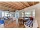 Bright living room with wood ceiling, lots of seating, and large windows letting in natural light at 2308 Canasta Dr, Bradenton Beach, FL 34217