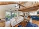 Spacious living room with high ceilings, wood floors, and a seamless transition to the outdoor deck at 2308 Canasta Dr, Bradenton Beach, FL 34217