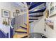Stylish spiral staircase with wooden steps and metal railings, showcasing architectural detail at 2308 Canasta Dr, Bradenton Beach, FL 34217