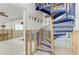 Unique blue spiral staircase in a partially renovated home, offering a distinctive architectural element at 2308 Canasta Dr, Bradenton Beach, FL 34217