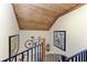 Unique staircase, featuring a custom wood ceiling with blue bannister railing and decor at 2308 Canasta Dr, Bradenton Beach, FL 34217