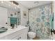 Charming bathroom with decorative shower curtain, framed crab art, and stylish vanity at 2431 Bayshore Gardens Pkwy # 19, Bradenton, FL 34207