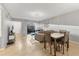 An open-concept dining area with views to the living room, offering a modern space for gatherings at 2431 Bayshore Gardens Pkwy # 19, Bradenton, FL 34207