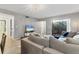 Spacious living area with a view to the patio, featuring comfortable seating and modern design elements at 2431 Bayshore Gardens Pkwy # 19, Bradenton, FL 34207
