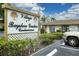 The sign for Village of Bayshore Gardens Condominiums under a blue sky at 2431 Bayshore Gardens Pkwy # 19, Bradenton, FL 34207