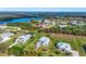 An aerial shot of a neighborhood near a river, showcasing waterfront properties and lush landscapes at 28960 Gin Ln, Punta Gorda, FL 33982