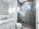 Well-lit bathroom featuring an enclosed glass shower with modern tiling and vanity with great counterspace at 28960 Gin Ln, Punta Gorda, FL 33982