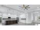 Open kitchen with white cabinetry, stylish backsplash, stainless appliances, and a large island at 28960 Gin Ln, Punta Gorda, FL 33982