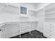 Walk-in closet featuring custom shelving, hanging racks, and drawers to maximize storage space at 28960 Gin Ln, Punta Gorda, FL 33982