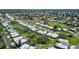Beautiful neighborhood setting featuring mature trees and lush green grass at 3278 Village Green Dr # 1024, Sarasota, FL 34239