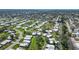 Well-maintained community featuring mature trees and lush green grass at 3278 Village Green Dr # 1024, Sarasota, FL 34239