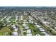 Aerial view of a residential neighborhood with well-maintained lawns and mature trees at 3278 Village Green Dr # 1024, Sarasota, FL 34239