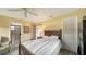 Cozy bedroom featuring a convenient ensuite bathroom and sliding barn door at 3278 Village Green Dr # 1024, Sarasota, FL 34239
