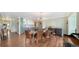 Dining area featuring wood floors, a chandelier, and stylish furnishings at 3278 Village Green Dr # 1024, Sarasota, FL 34239
