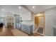 Renovated kitchen features light cabinets and granite countertops with stainless appliances at 3278 Village Green Dr # 1024, Sarasota, FL 34239