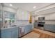 Modern kitchen with updated appliances, granite countertops, and ample cabinet space at 3278 Village Green Dr # 1024, Sarasota, FL 34239