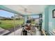 Bright office space with large windows overlooking a well-manicured lawn and neighborhood view at 3278 Village Green Dr # 1024, Sarasota, FL 34239