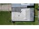 Aerial shot showcases the roof's condition, design, and integration with the surrounding landscape at 3278 Village Green Dr # 1024, Sarasota, FL 34239