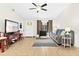 Inviting living room featuring a comfortable gray sofa, media center with TV, and neutral tiled floors at 3300 Loveland Blvd # 3203, Punta Gorda, FL 33980